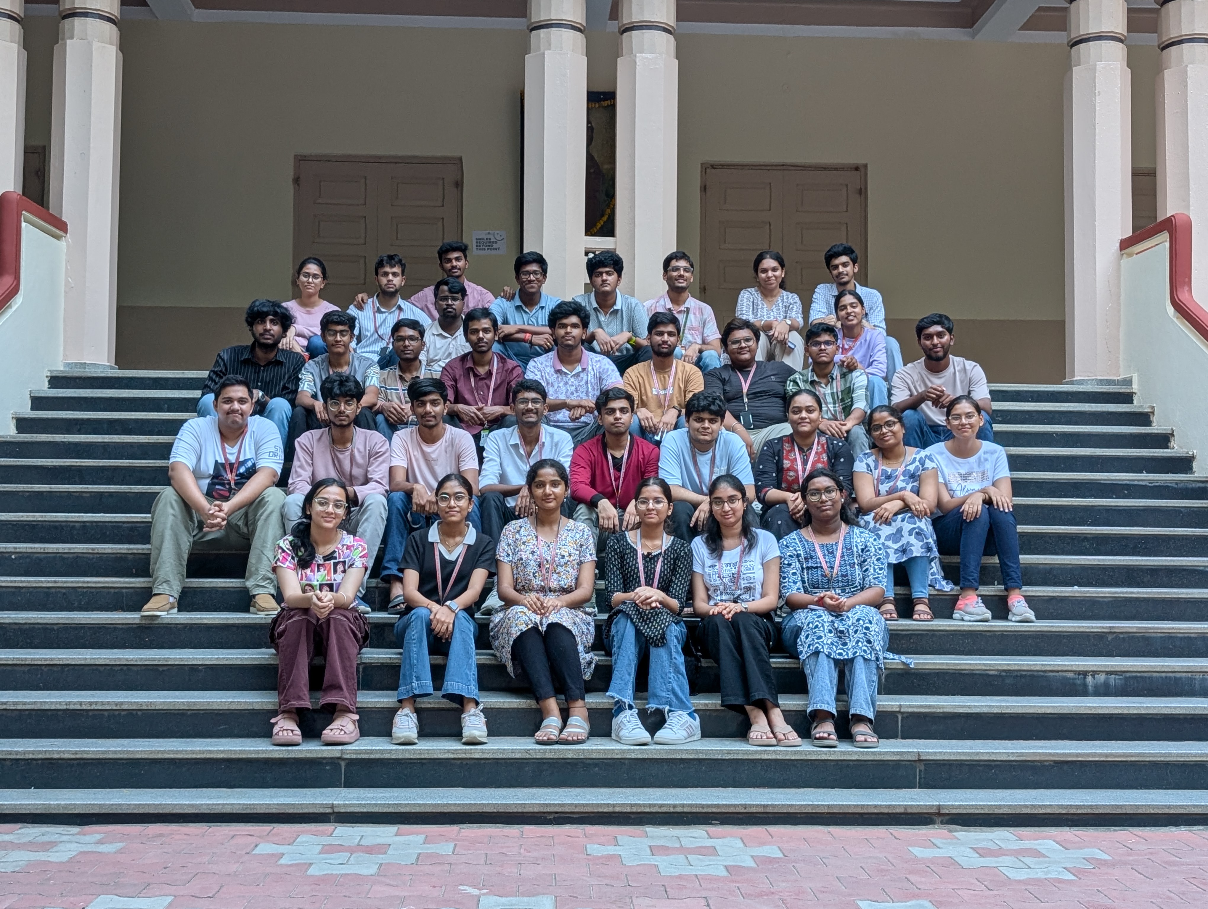 Recurse members seated together on the campus steps