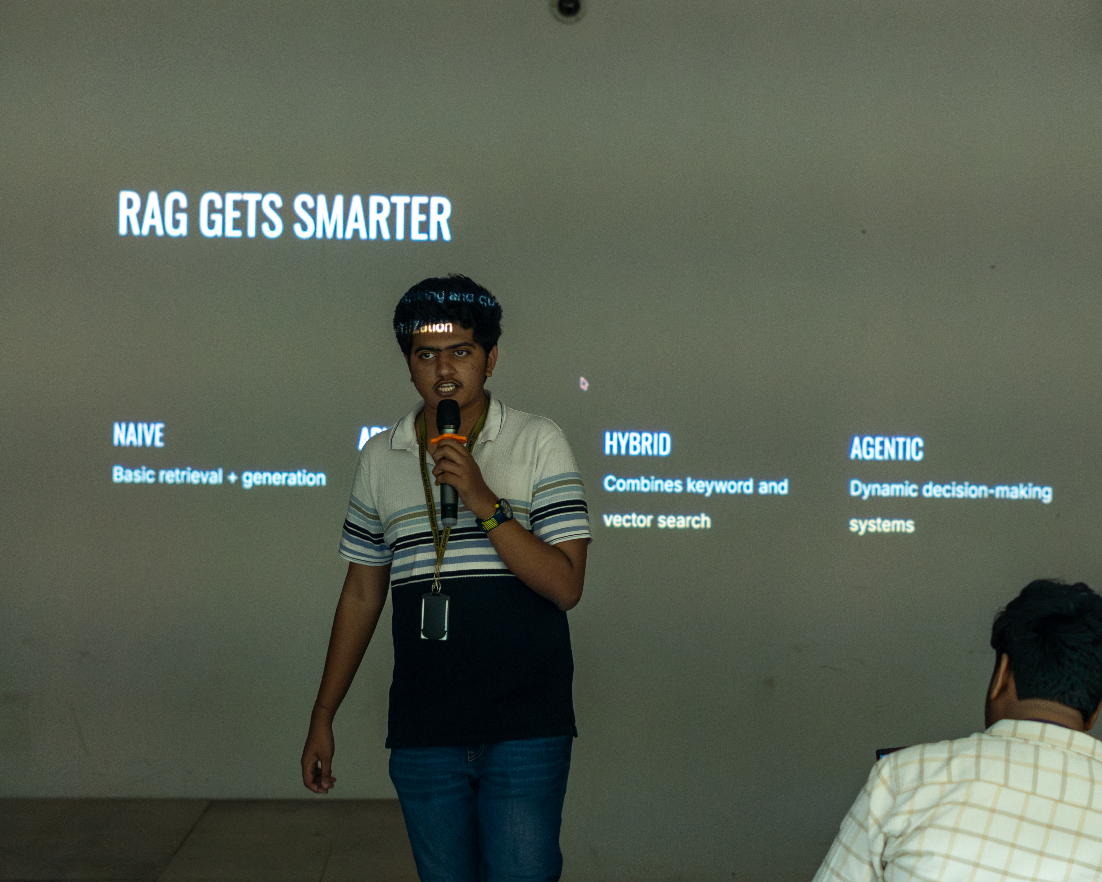 A speaker explaining retrieval-augmented generation at ReBoot